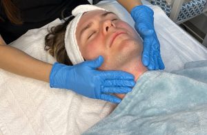 man receiving a facial